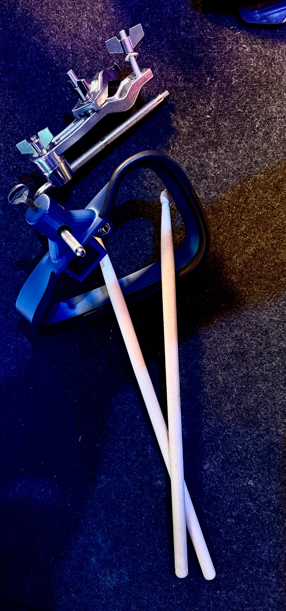 Trigger tambourine alongside drumsticks